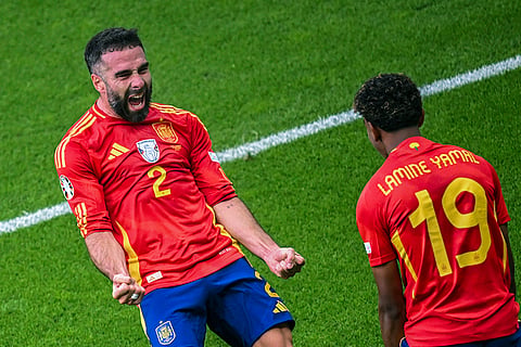 Dani Carvajal celebrates after scoring his side's third goal 